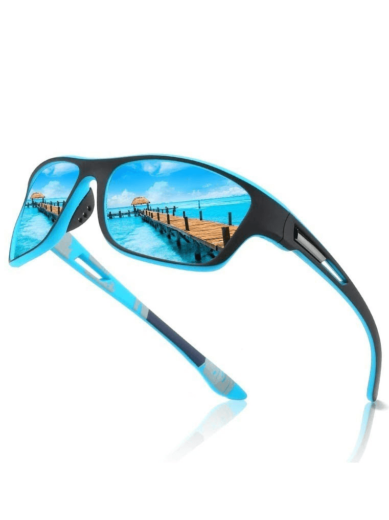 Stylish polarized sports sunglasses with blue lenses reflecting a sunny seaside view, perfect for driving or hiking. Model SF0226.